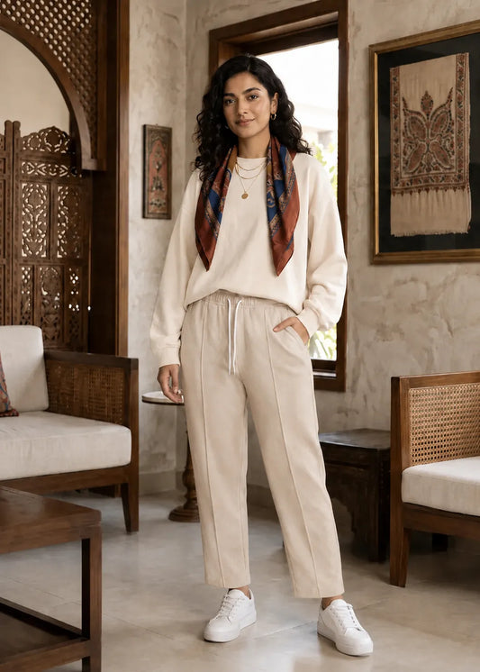 Light beige drawstring jogger trousers with elastic waistband