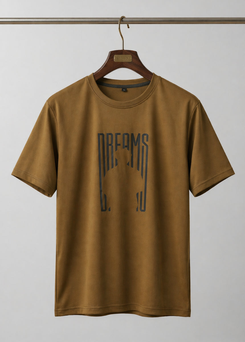 Brown Dreams graphic T-shirt front view hanging on wooden hanger
