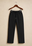 Stylish graphic T-shirt paired with premium black and white trousers.