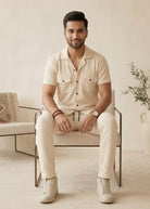 Close-up of cream textured shirt with buttons and pockets breathable fabric
