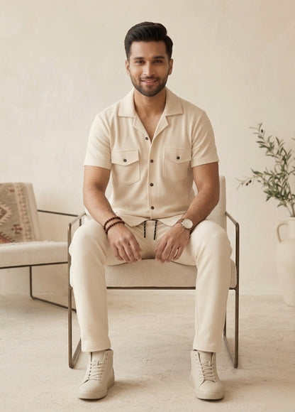 Close-up of cream textured shirt with buttons and pockets breathable fabric