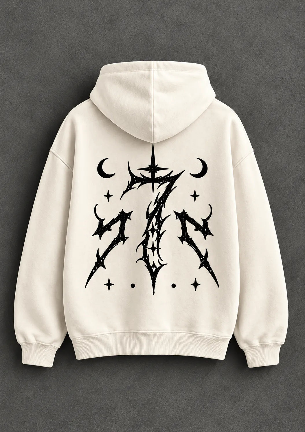 Back view of a cream graphic hoodie featuring a striking black gothic-style design with celestial elements.