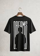 Black Dreams graphic T-shirt front view on hanger with minimalist print