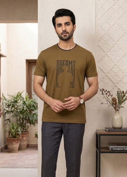 Brown Dreams graphic T-shirt front view hanging on wooden hanger