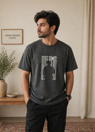 Charcoal grey Dreams graphic T-shirt front view hanging on wooden hanger