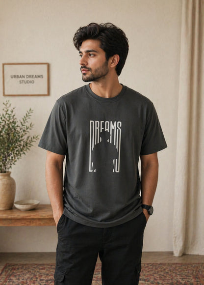 Charcoal grey Dreams graphic T-shirt front view hanging on wooden hanger