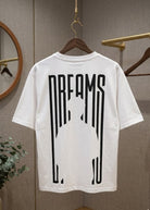 White Dreams graphic T-shirt front view hanging on wooden hanger