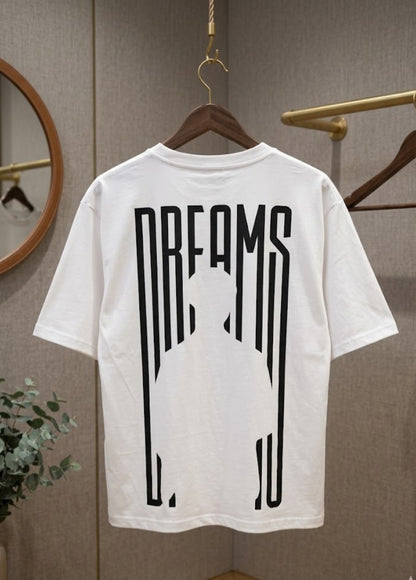 White Dreams graphic T-shirt front view hanging on wooden hanger