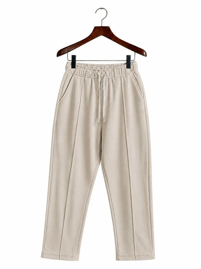 Beige wide-leg cropped pants with an elastic drawstring waist
